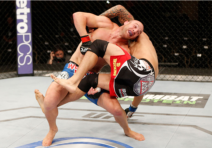 ALBUQUERQUE, NM - JUNE 07: (L-R) Patrick Cummins takes down Roger Narvaez in their light heavyweight fight during the UFC Fight Night event at Tingley Coliseum on June 7, 2014 in Albuquerque, New Mexico. (Photo by Josh Hedges/Zuffa LLC/Zuffa LLC via Get