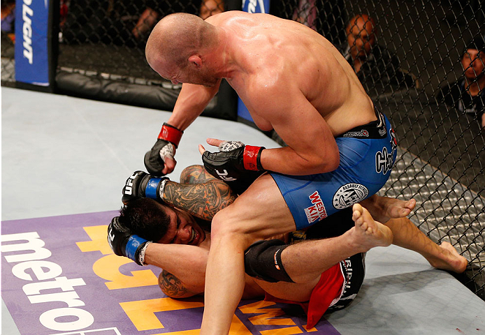 ALBUQUERQUE, NM - JUNE 07: (R-L) Patrick Cummins punches Roger Narvaez in their light heavyweight fight during the UFC Fight Night event at Tingley Coliseum on June 7, 2014 in Albuquerque, New Mexico. (Photo by Josh Hedges/Zuffa LLC/Zuffa LLC via Getty