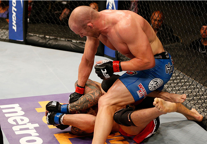 ALBUQUERQUE, NM - JUNE 07: (R-L) Patrick Cummins punches Roger Narvaez in their light heavyweight fight during the UFC Fight Night event at Tingley Coliseum on June 7, 2014 in Albuquerque, New Mexico. (Photo by Josh Hedges/Zuffa LLC/Zuffa LLC via Getty