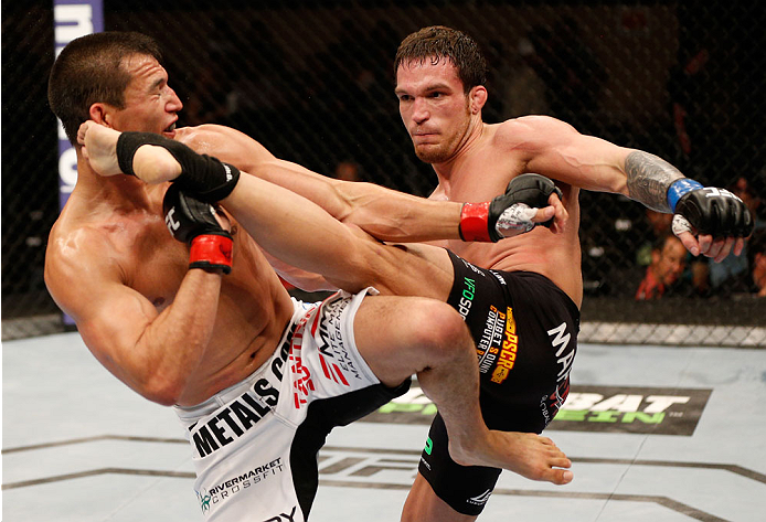 ALBUQUERQUE, NM - JUNE 07:  (R-L) Lance Benoist kicks Bobby Voelker in their welterweight fight during the UFC Fight Night event at Tingley Coliseum on June 7, 2014 in Albuquerque, New Mexico.  (Photo by Josh Hedges/Zuffa LLC/Zuffa LLC via Getty Images)