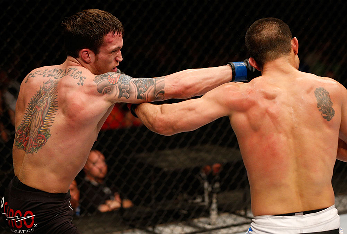 ALBUQUERQUE, NM - JUNE 07: (L-R) Lance Benoist punches Bobby Voelker in their welterweight fight during the UFC Fight Night event at Tingley Coliseum on June 7, 2014 in Albuquerque, New Mexico. (Photo by Josh Hedges/Zuffa LLC/Zuffa LLC via Getty Images)