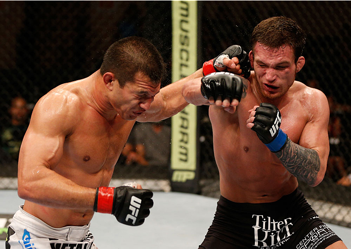 ALBUQUERQUE, NM - JUNE 07: (R-L) Lance Benoist and Bobby Voelker trade punches in their welterweight fight during the UFC Fight Night event at Tingley Coliseum on June 7, 2014 in Albuquerque, New Mexico. (Photo by Josh Hedges/Zuffa LLC/Zuffa LLC via Get