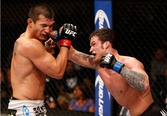 ALBUQUERQUE, NM - JUNE 07:  (R-L) Lance Benoist punches Bobby Voelker in their welterweight fight during the UFC Fight Night event at Tingley Coliseum on June 7, 2014 in Albuquerque, New Mexico.  (Photo by Josh Hedges/Zuffa LLC/Zuffa LLC via Getty Images)