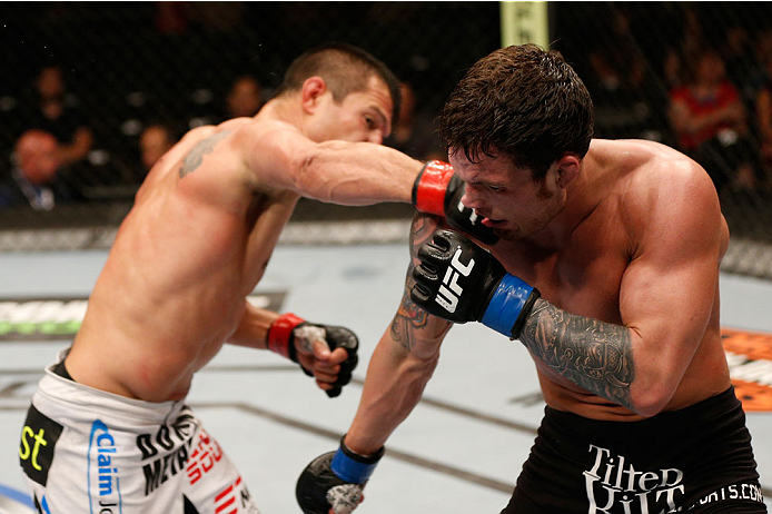 ALBUQUERQUE, NM - JUNE 07: (L-R) Bobby Voelker punches Lance Benoist in their welterweight fight during the UFC Fight Night event at Tingley Coliseum on June 7, 2014 in Albuquerque, New Mexico. (Photo by Josh Hedges/Zuffa LLC/Zuffa LLC via Getty Images)