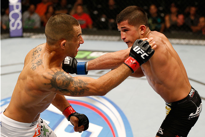 ALBUQUERQUE, NM - JUNE 07:  (R-L) Sergio Pettis punches Yaotzin Meza in their bantamweight fight during the UFC Fight Night event at Tingley Coliseum on June 7, 2014 in Albuquerque, New Mexico.  (Photo by Josh Hedges/Zuffa LLC/Zuffa LLC via Getty Images)