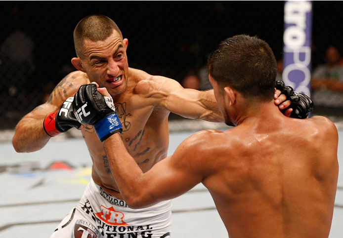 ALBUQUERQUE, NM - JUNE 07:  (L-R) Yaotzin Meza punches Sergio Pettis in their bantamweight fight during the UFC Fight Night event at Tingley Coliseum on June 7, 2014 in Albuquerque, New Mexico.  (Photo by Josh Hedges/Zuffa LLC/Zuffa LLC via Getty Images)