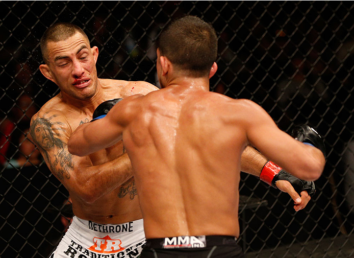 ALBUQUERQUE, NM - JUNE 07:  (R-L) Sergio Pettis punches Yaotzin Meza in their bantamweight fight during the UFC Fight Night event at Tingley Coliseum on June 7, 2014 in Albuquerque, New Mexico.  (Photo by Josh Hedges/Zuffa LLC/Zuffa LLC via Getty Images)