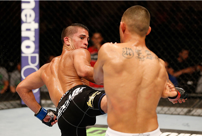 ALBUQUERQUE, NM - JUNE 07: (L-R) Sergio Pettis kicks Yaotzin Meza in their bantamweight fight during the UFC Fight Night event at Tingley Coliseum on June 7, 2014 in Albuquerque, New Mexico. (Photo by Josh Hedges/Zuffa LLC/Zuffa LLC via Getty Images)