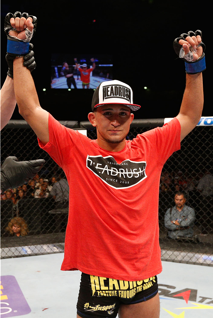 ALBUQUERQUE, NM - JUNE 07:  Sergio Pettis reacts after his decision victory over Yaotzin Meza in their bantamweight fight during the UFC Fight Night event at Tingley Coliseum on June 7, 2014 in Albuquerque, New Mexico.  (Photo by Josh Hedges/Zuffa LLC/Zuf