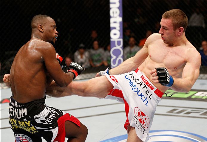 ALBUQUERQUE, NM - JUNE 07:  (R-L) Piotr Hallmann kicks Yves Edwards in their lightweight fight during the UFC Fight Night event at Tingley Coliseum on June 7, 2014 in Albuquerque, New Mexico.  (Photo by Josh Hedges/Zuffa LLC/Zuffa LLC via Getty Images)