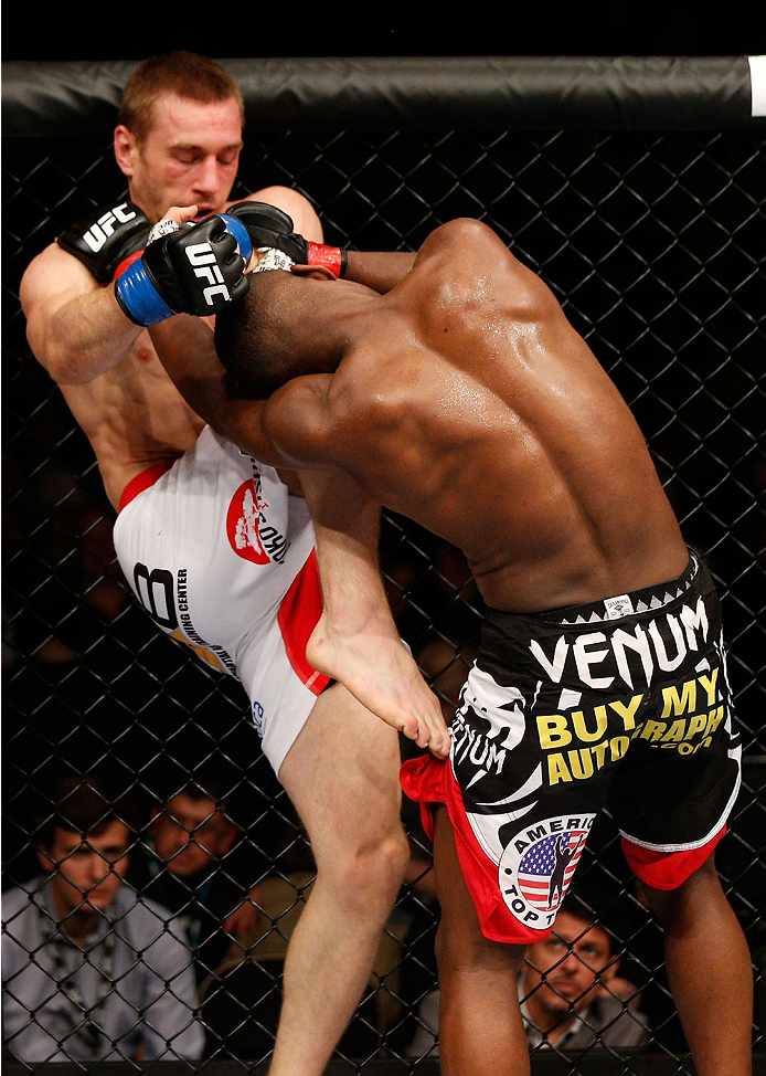 ALBUQUERQUE, NM - JUNE 07:  (L-R) Piotr Hallmann knees Yves Edwards in their lightweight fight during the UFC Fight Night event at Tingley Coliseum on June 7, 2014 in Albuquerque, New Mexico.  (Photo by Josh Hedges/Zuffa LLC/Zuffa LLC via Getty Images)