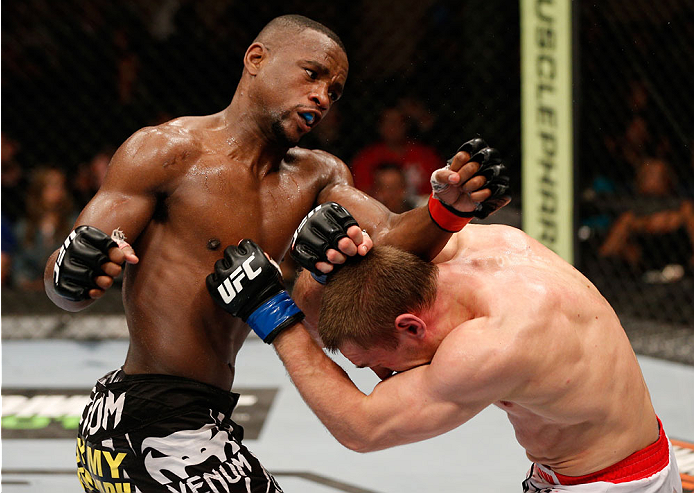 ALBUQUERQUE, NM - JUNE 07:  (L-R) Yves Edwards punches Piotr Hallmann in their lightweight fight during the UFC Fight Night event at Tingley Coliseum on June 7, 2014 in Albuquerque, New Mexico.  (Photo by Josh Hedges/Zuffa LLC/Zuffa LLC via Getty Images)