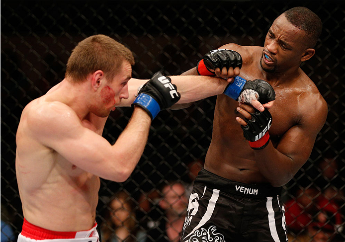 ALBUQUERQUE, NM - JUNE 07:  (L-R) Piotr Hallmann punches Yves Edwards in their lightweight fight during the UFC Fight Night event at Tingley Coliseum on June 7, 2014 in Albuquerque, New Mexico.  (Photo by Josh Hedges/Zuffa LLC/Zuffa LLC via Getty Images)