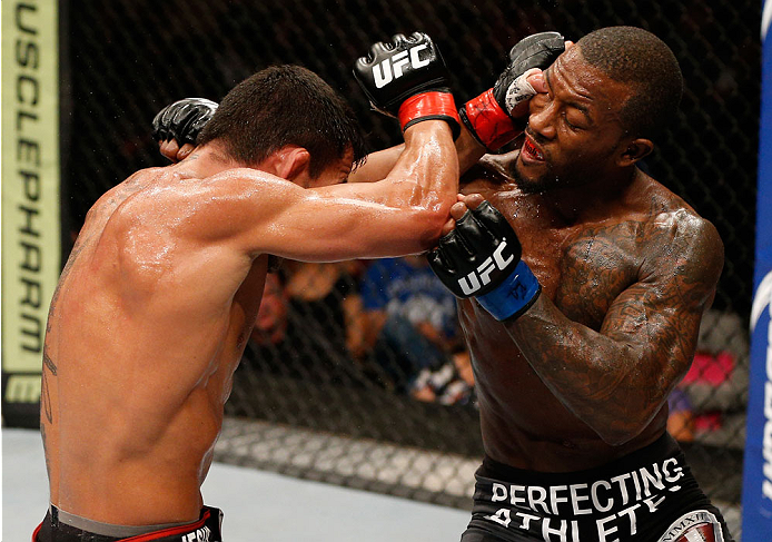 ALBUQUERQUE, NM - JUNE 07:  (L-R) Rafael Dos Anjos accidentally thumbs Jason High in the eye in their lightweight fight during the UFC Fight Night event at Tingley Coliseum on June 7, 2014 in Albuquerque, New Mexico.  (Photo by Josh Hedges/Zuffa LLC/Zuffa