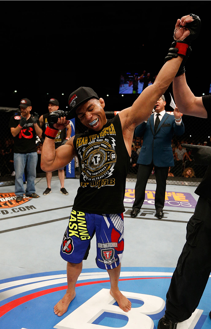 ALBUQUERQUE, NM - JUNE 07: John Dodson reacts after his victory over John Moraga in their flyweight fight during the UFC Fight Night event at Tingley Coliseum on June 7, 2014 in Albuquerque, New Mexico. (Photo by Josh Hedges/Zuffa LLC/Zuffa LLC via Gett