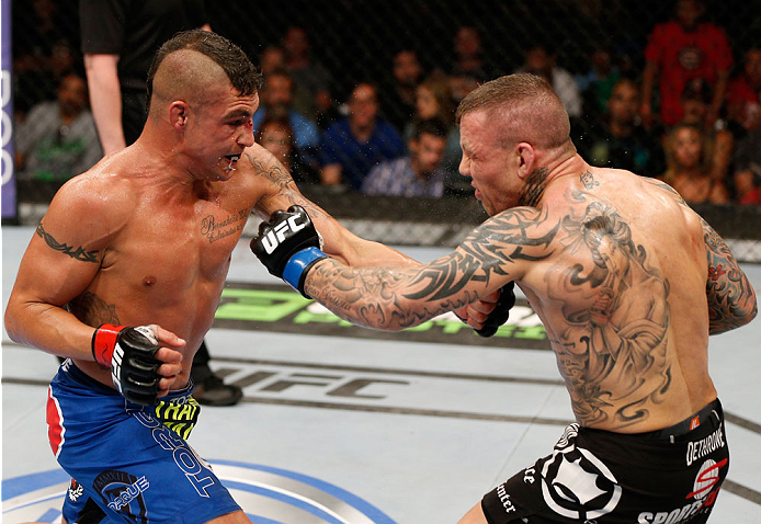 ALBUQUERQUE, NM - JUNE 07:  (L-R) Diego Sanchez punches Ross Pearson in their lightweight fight during the UFC Fight Night event at Tingley Coliseum on June 7, 2014 in Albuquerque, New Mexico.  (Photo by Josh Hedges/Zuffa LLC/Zuffa LLC via Getty Images)