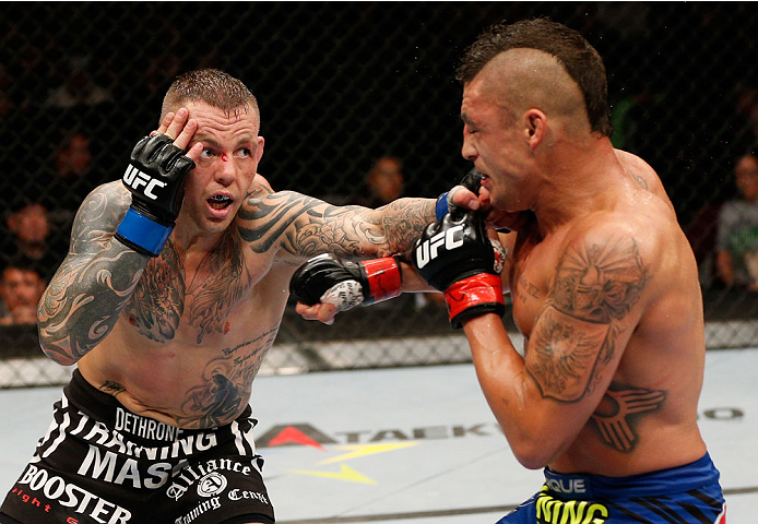 ALBUQUERQUE, NM - JUNE 07:  (L-R) Ross Pearson punches Diego Sanchez in their lightweight fight during the UFC Fight Night event at Tingley Coliseum on June 7, 2014 in Albuquerque, New Mexico.  (Photo by Josh Hedges/Zuffa LLC/Zuffa LLC via Getty Images)