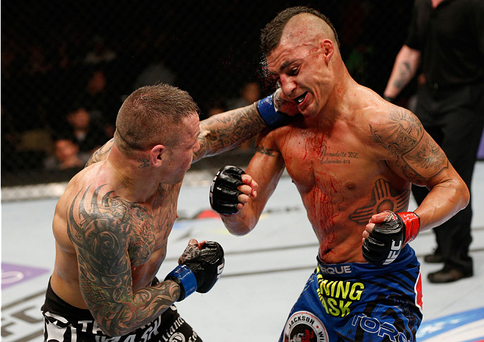 ALBUQUERQUE, NM - JUNE 07:  (L-R) Ross Pearson punches Diego Sanchez in their lightweight fight during the UFC Fight Night event at Tingley Coliseum on June 7, 2014 in Albuquerque, New Mexico.  (Photo by Josh Hedges/Zuffa LLC/Zuffa LLC via Getty Images)