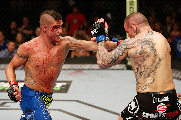 ALBUQUERQUE, NM - JUNE 07:  (L-R) Diego Sanchez punches Ross Pearson in their lightweight fight during the UFC Fight Night event at Tingley Coliseum on June 7, 2014 in Albuquerque, New Mexico.  (Photo by Josh Hedges/Zuffa LLC/Zuffa LLC via Getty Images)