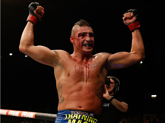 ALBUQUERQUE, NM - JUNE 07:  Diego Sanchez celebrates after the conclusion of his lightweight fight against Ross Pearson during the UFC Fight Night event at Tingley Coliseum on June 7, 2014 in Albuquerque, New Mexico.  (Photo by Josh Hedges/Zuffa LLC/Zuffa