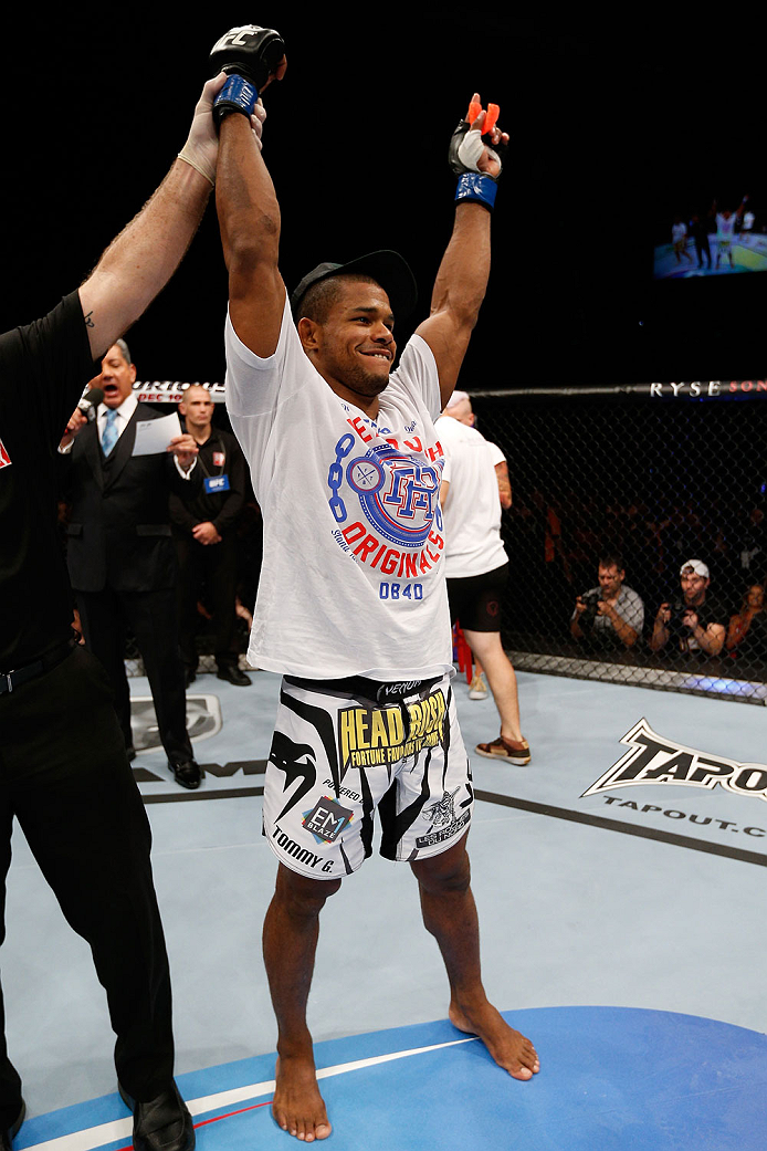 BRISBANE, AUSTRALIA - DECEMBER 07: Alex Garcia reacts after his knockout victory over Ben Wall in their welterweight fight during the UFC Fight Night event at the Brisbane Entertainment Centre on December 7, 2013 in Brisbane, Australia. (Photo by Josh He