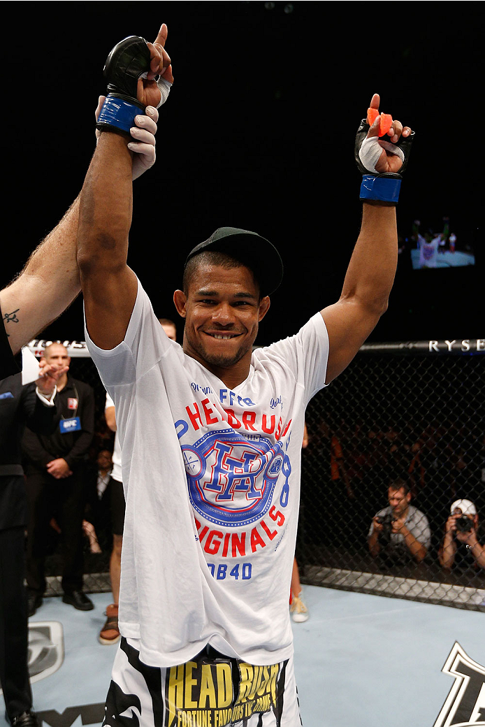 BRISBANE, AUSTRALIA - DECEMBER 07: Alex Garcia reacts after his knockout victory over Ben Wall in their welterweight fight during the UFC Fight Night event at the Brisbane Entertainment Centre on December 7, 2013 in Brisbane, Australia. (Photo by Josh He