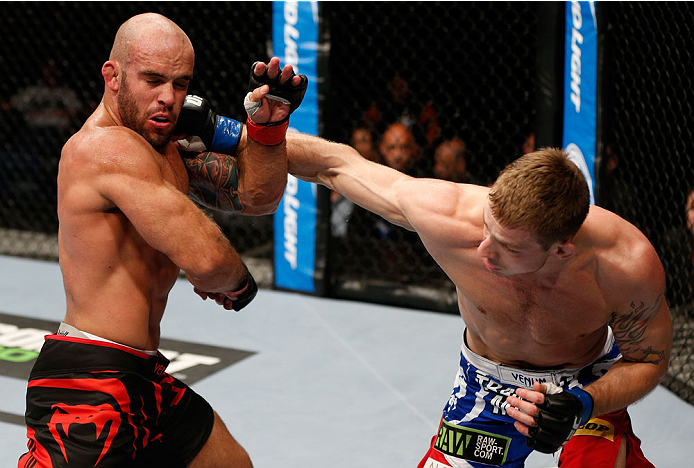 BRISBANE, AUSTRALIA - DECEMBER 07: (R-L) Krzysztof Jotko punches Bruno Santos in their middleweight fight during the UFC Fight Night event at the Brisbane Entertainment Centre on December 7, 2013 in Brisbane, Australia. (Photo by Josh Hedges/Zuffa LLC/Zu