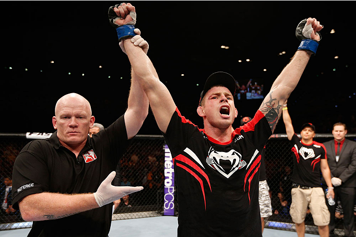 BRISBANE, AUSTRALIA - DECEMBER 07: Krzysztof Jotko reacts after his decision victory over Bruno Santos in their middleweight fight during the UFC Fight Night event at the Brisbane Entertainment Centre on December 7, 2013 in Brisbane, Australia. (Photo by