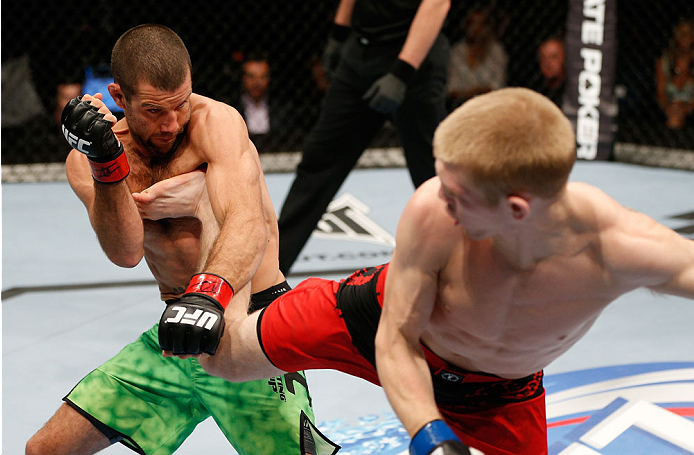 BRISBANE, AUSTRALIA - DECEMBER 07: (R-L) Justin Scoggins kicks Richie Vaculik in their flyweight fight during the UFC Fight Night event at the Brisbane Entertainment Centre on December 7, 2013 in Brisbane, Australia. (Photo by Josh Hedges/Zuffa LLC/Zuffa