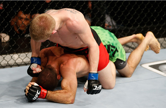 BRISBANE, AUSTRALIA - DECEMBER 07: Justin Scoggins (top) punches Richie Vaculik in their flyweight fight during the UFC Fight Night event at the Brisbane Entertainment Centre on December 7, 2013 in Brisbane, Australia. (Photo by Josh Hedges/Zuffa LLC/Zuf