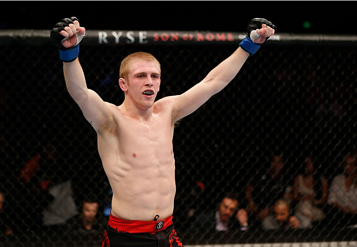 BRISBANE, AUSTRALIA - DECEMBER 07: Justin Scoggins reacts after his TKO victory over Richie Vaculik in their flyweight fight during the UFC Fight Night event at the Brisbane Entertainment Centre on December 7, 2013 in Brisbane, Australia. (Photo by Josh