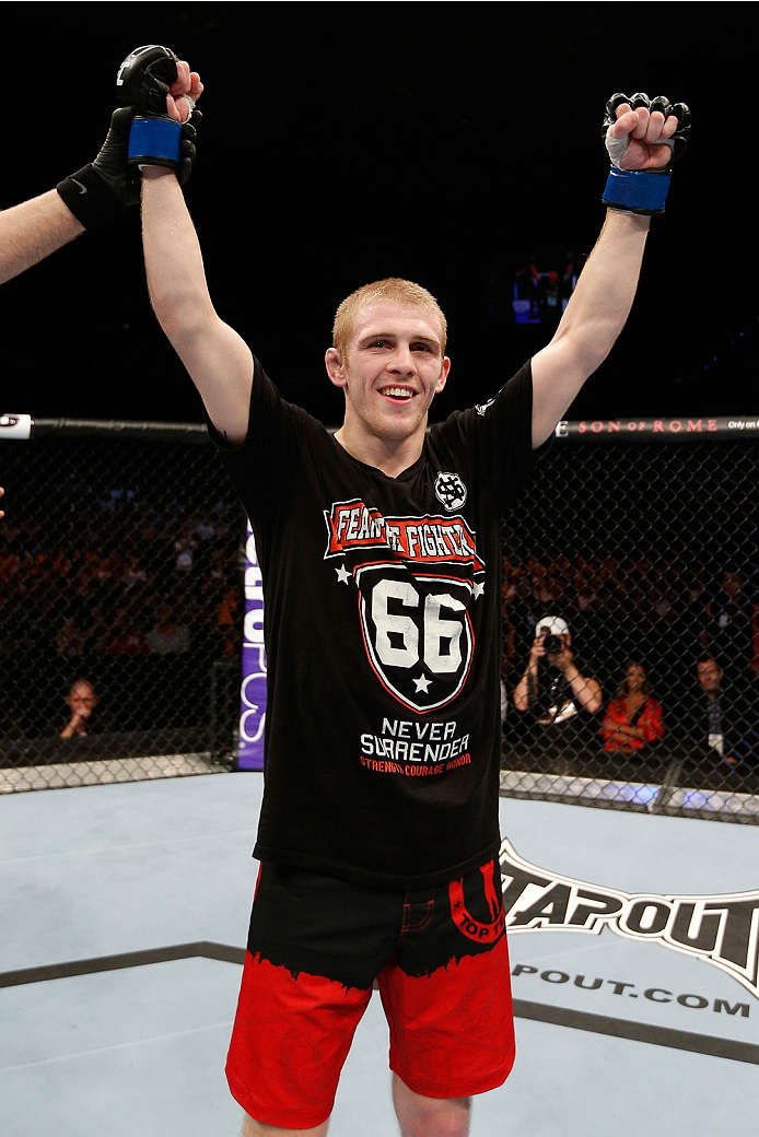 BRISBANE, AUSTRALIA - DECEMBER 07: Justin Scoggins reacts after his TKO victory over Richie Vaculik in their flyweight fight during the UFC Fight Night event at the Brisbane Entertainment Centre on December 7, 2013 in Brisbane, Australia. (Photo by Josh