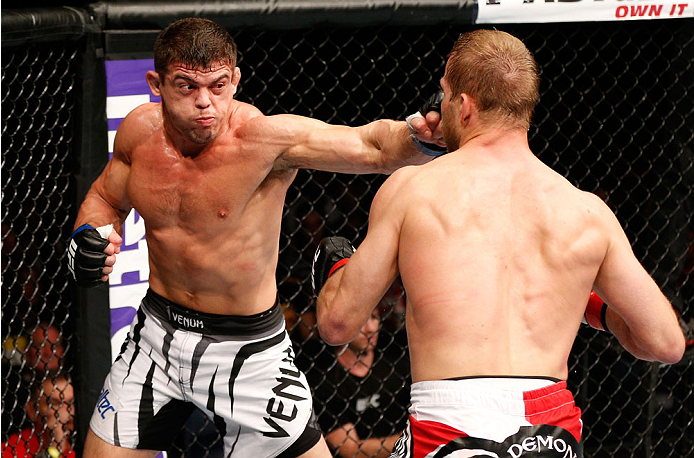 BRISBANE, AUSTRALIA - DECEMBER 07: (L-R) Caio Magalhaes punches Nick Ring in their middleweight fight during the UFC Fight Night event at the Brisbane Entertainment Centre on December 7, 2013 in Brisbane, Australia. (Photo by Josh Hedges/Zuffa LLC/Zuffa