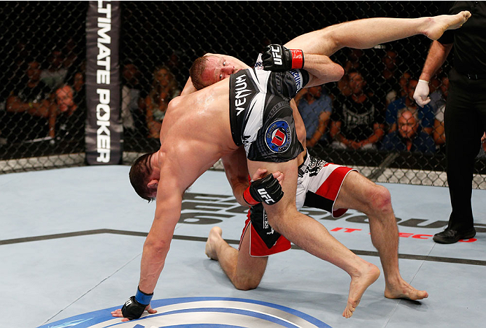 BRISBANE, AUSTRALIA - DECEMBER 07: (R-L) Nick Ring attempts to take down Caio Magalhaes in their middleweight fight during the UFC Fight Night event at the Brisbane Entertainment Centre on December 7, 2013 in Brisbane, Australia. (Photo by Josh Hedges/Zu