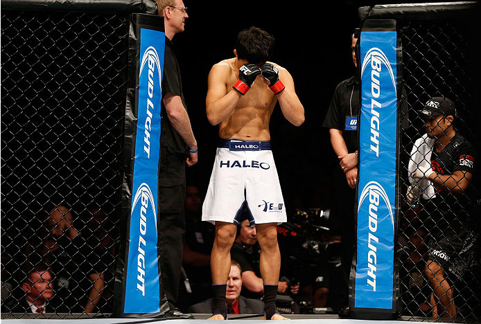 BRISBANE, AUSTRALIA - DECEMBER 07: Takeya Mizugaki prepares to enter the Octagon before his bantamweight fight against Nam Phan during the UFC Fight Night event at the Brisbane Entertainment Centre on December 7, 2013 in Brisbane, Australia. (Photo by Jo