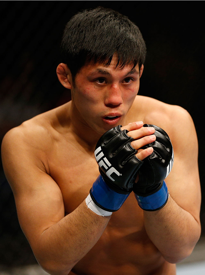BRISBANE, AUSTRALIA - DECEMBER 07: Nam Phan stands in the Octagon during his bantamweight fight against Takeya Mizugaki during the UFC Fight Night event at the Brisbane Entertainment Centre on December 7, 2013 in Brisbane, Australia. (Photo by Josh Hedge