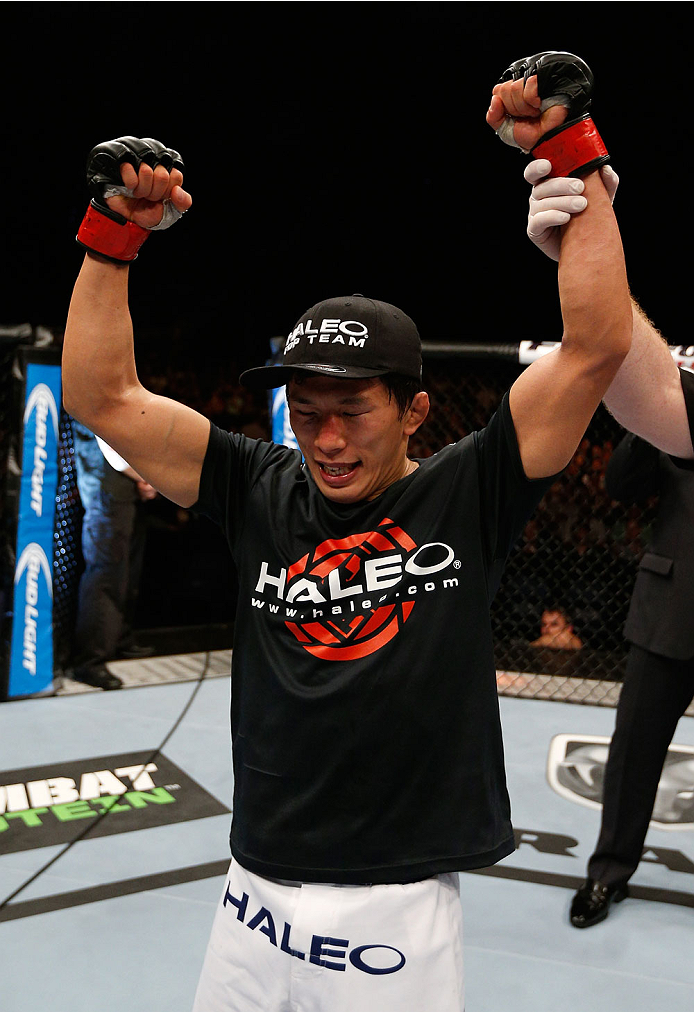 BRISBANE, AUSTRALIA - DECEMBER 07: Takeya Mizugaki reacts after his victory over Nam Phan in their bantamweight fight during the UFC Fight Night event at the Brisbane Entertainment Centre on December 7, 2013 in Brisbane, Australia. (Photo by Josh Hedges/