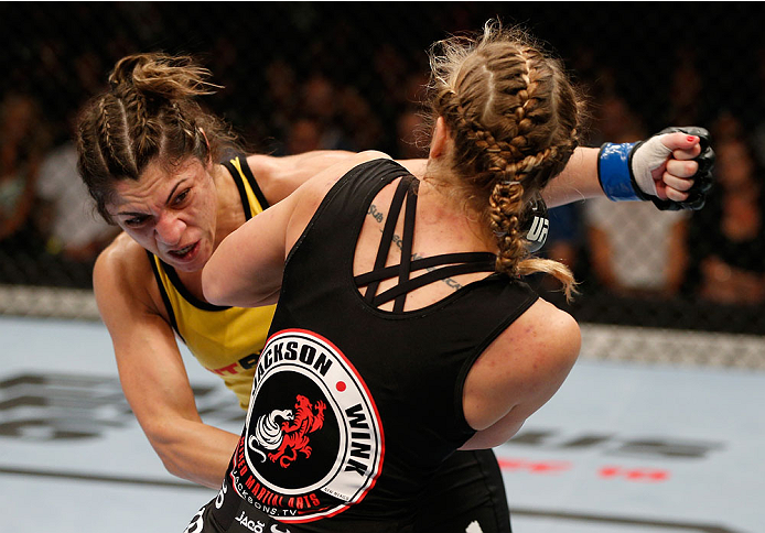 BRISBANE, AUSTRALIA - DECEMBER 07: (L-R) Bethe Correia punches Julie Kedzie in their women's bantamweight fight during the UFC Fight Night event at the Brisbane Entertainment Centre on December 7, 2013 in Brisbane, Australia. (Photo by Josh Hedges/Zuffa