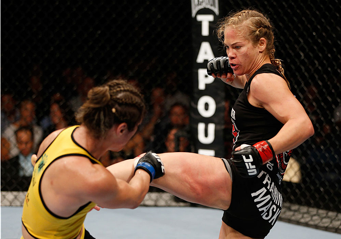 BRISBANE, AUSTRALIA - DECEMBER 07: (R-L) Julie Kedzie kicks Bethe Correia in their women's bantamweight fight during the UFC Fight Night event at the Brisbane Entertainment Centre on December 7, 2013 in Brisbane, Australia. (Photo by Josh Hedges/Zuffa LL
