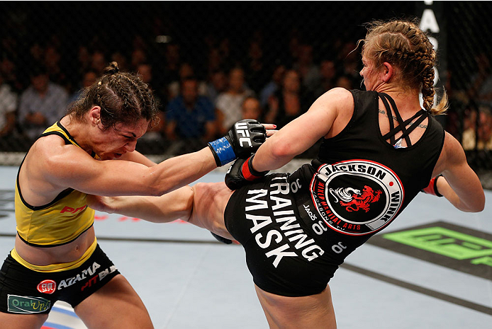 BRISBANE, AUSTRALIA - DECEMBER 07: (R-L) Julie Kedzie kicks Bethe Correia in their women's bantamweight fight during the UFC Fight Night event at the Brisbane Entertainment Centre on December 7, 2013 in Brisbane, Australia. (Photo by Josh Hedges/Zuffa LL