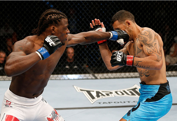 BRISBANE, AUSTRALIA - DECEMBER 07: (L-R) Clint Hester punches Dylan Andrews in their middleweight fight during the UFC Fight Night event at the Brisbane Entertainment Centre on December 7, 2013 in Brisbane, Australia. (Photo by Josh Hedges/Zuffa LLC/Zuff