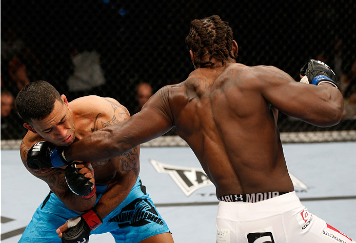 BRISBANE, AUSTRALIA - DECEMBER 07: (R-L) Clint Hester punches Dylan Andrews in their middleweight fight during the UFC Fight Night event at the Brisbane Entertainment Centre on December 7, 2013 in Brisbane, Australia. (Photo by Josh Hedges/Zuffa LLC/Zuff