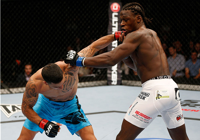 BRISBANE, AUSTRALIA - DECEMBER 07: (L-R) Dylan Andrews punches Clint Hester in their middleweight fight during the UFC Fight Night event at the Brisbane Entertainment Centre on December 7, 2013 in Brisbane, Australia. (Photo by Josh Hedges/Zuffa LLC/Zuff
