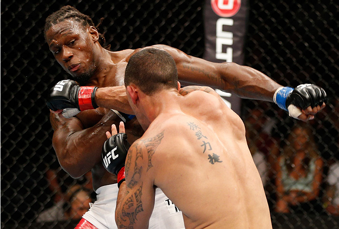 BRISBANE, AUSTRALIA - DECEMBER 07: (R-L) Dylan Andrews punches Clint Hester in their middleweight fight during the UFC Fight Night event at the Brisbane Entertainment Centre on December 7, 2013 in Brisbane, Australia. (Photo by Josh Hedges/Zuffa LLC/Zuff