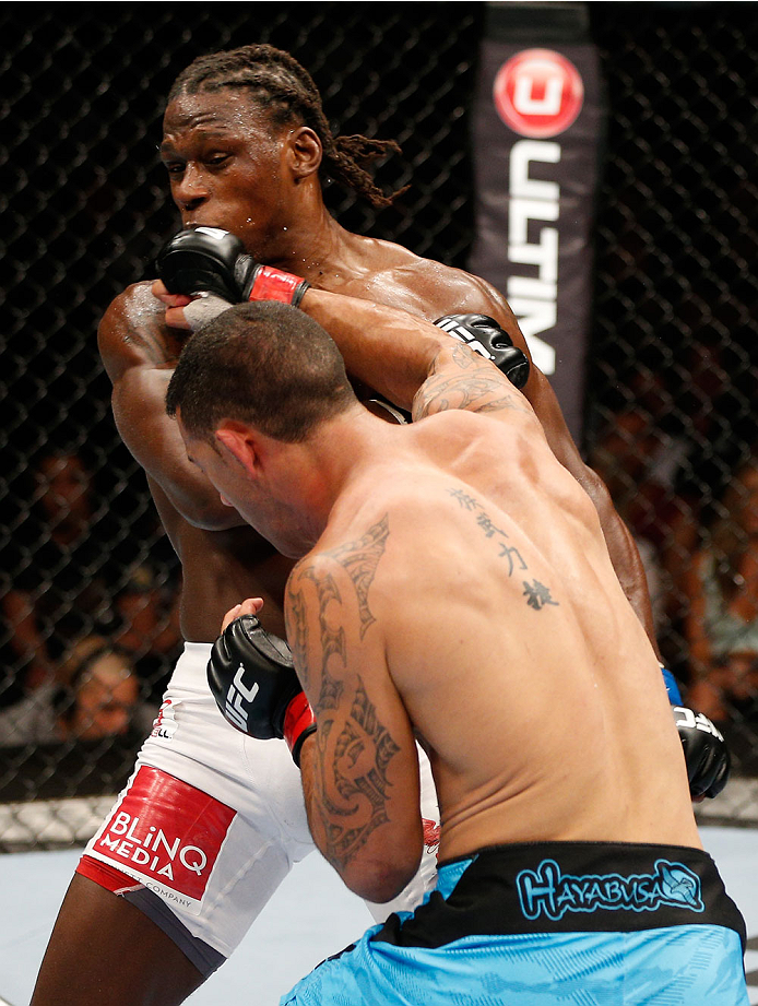 BRISBANE, AUSTRALIA - DECEMBER 07: (R-L) Dylan Andrews punches Clint Hester in their middleweight fight during the UFC Fight Night event at the Brisbane Entertainment Centre on December 7, 2013 in Brisbane, Australia. (Photo by Josh Hedges/Zuffa LLC/Zuff