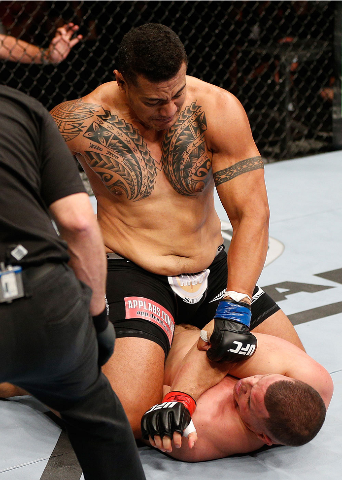 BRISBANE, AUSTRALIA - DECEMBER 07: Soa Palelei (top) punches Pat Barry in their heavyweight fight during the UFC Fight Night event at the Brisbane Entertainment Centre on December 7, 2013 in Brisbane, Australia. (Photo by Josh Hedges/Zuffa LLC/Zuffa LLC