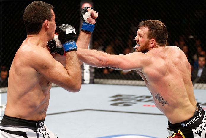 BRISBANE, AUSTRALIA - DECEMBER 07: (R-L) Ryan Bader punches Anthony Perosh in their light heavyweight fight during the UFC Fight Night event at the Brisbane Entertainment Centre on December 7, 2013 in Brisbane, Australia. (Photo by Josh Hedges/Zuffa LLC/
