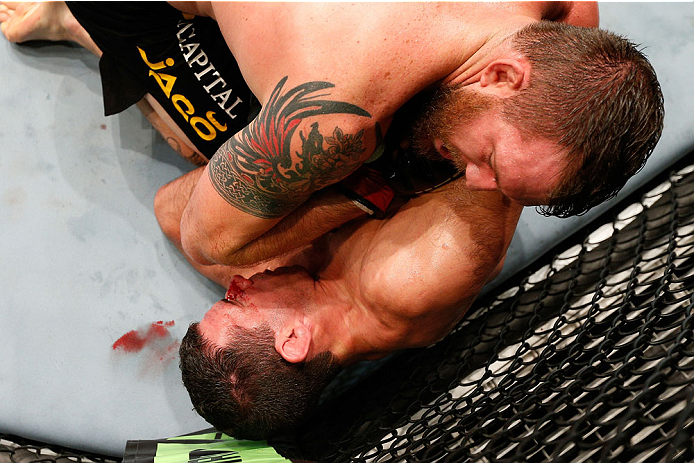 BRISBANE, AUSTRALIA - DECEMBER 07: Ryan Bader (top) elbows Anthony Perosh in their light heavyweight fight during the UFC Fight Night event at the Brisbane Entertainment Centre on December 7, 2013 in Brisbane, Australia. (Photo by Josh Hedges/Zuffa LLC/Z