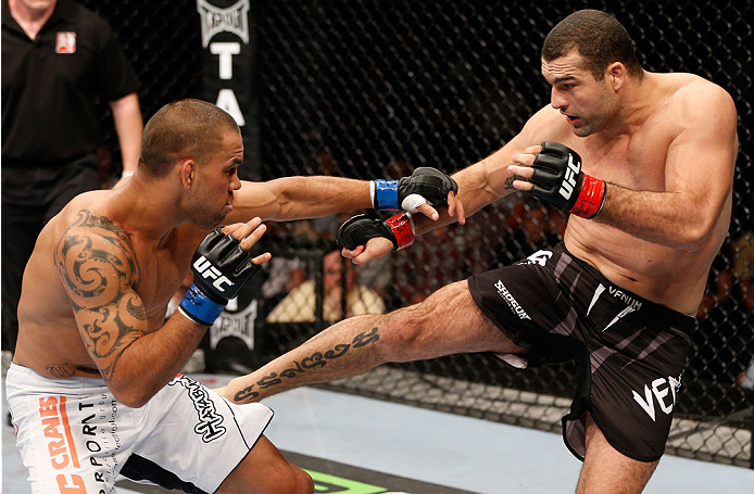 BRISBANE, AUSTRALIA - DECEMBER 07: (R-L) Mauricio "Shogun" Rua kicks James Te Huna in their light heavyweight fight during the UFC Fight Night event at the Brisbane Entertainment Centre on December 7, 2013 in Brisbane, Australia. (Photo by Josh Hedges/Zu