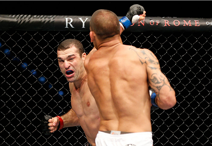 BRISBANE, AUSTRALIA - DECEMBER 07: (L-R) Mauricio "Shogun" Rua knocks out James Te Huna with a punch in their light heavyweight fight during the UFC Fight Night event at the Brisbane Entertainment Centre on December 7, 2013 in Brisbane, Australia. (Photo